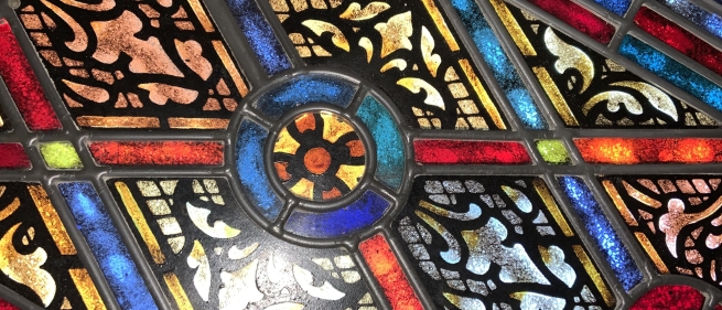 A photo of a church window, stained glass.